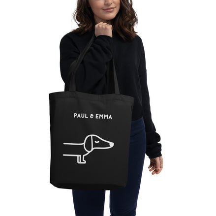 Schwarze Bio-Stofftasche mit weißem Dackel-Motiv und Paul Emma Logo - nachhaltige Hundetasche