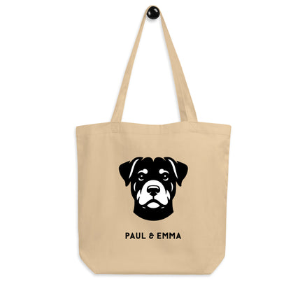 Beige Bio-Baumwolltasche mit schwarzem Rottweiler-Icon und Paul & Emma Logo - nachhaltige Tote Bag